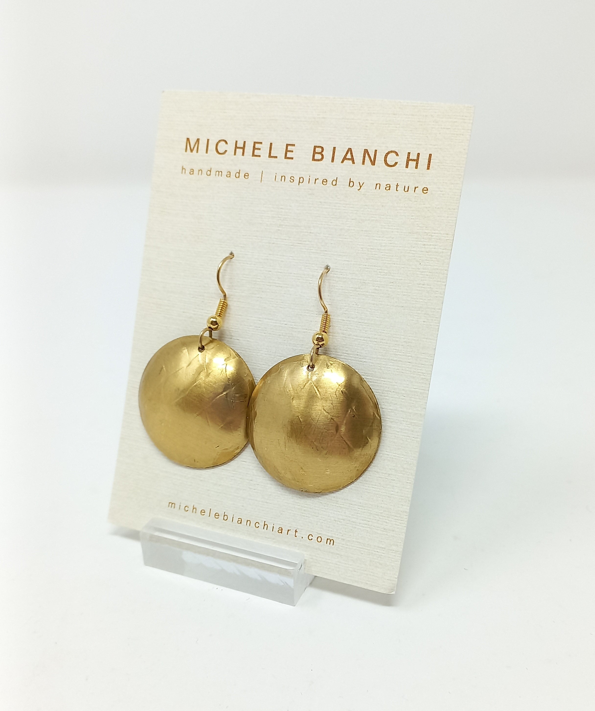 Brass domed disk earrings by Michele Bianchi