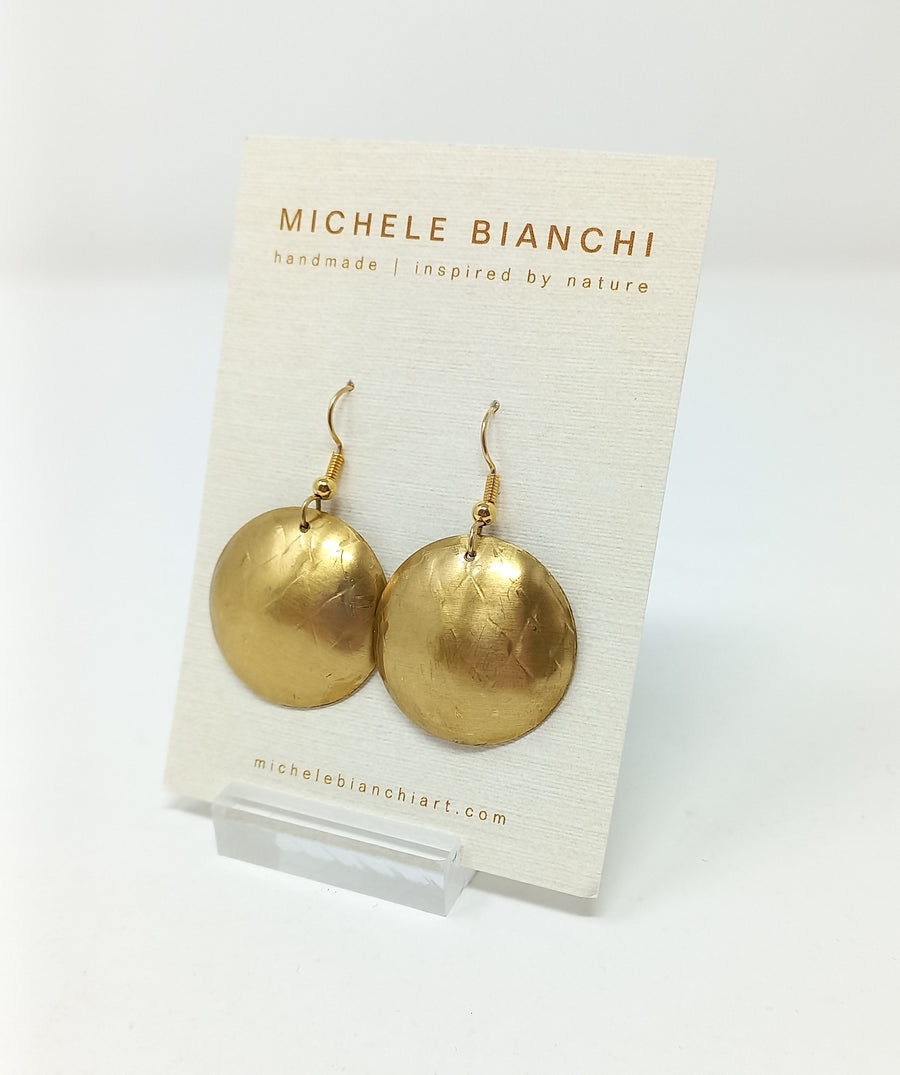 Brass domed disk earrings by Michele Bianchi